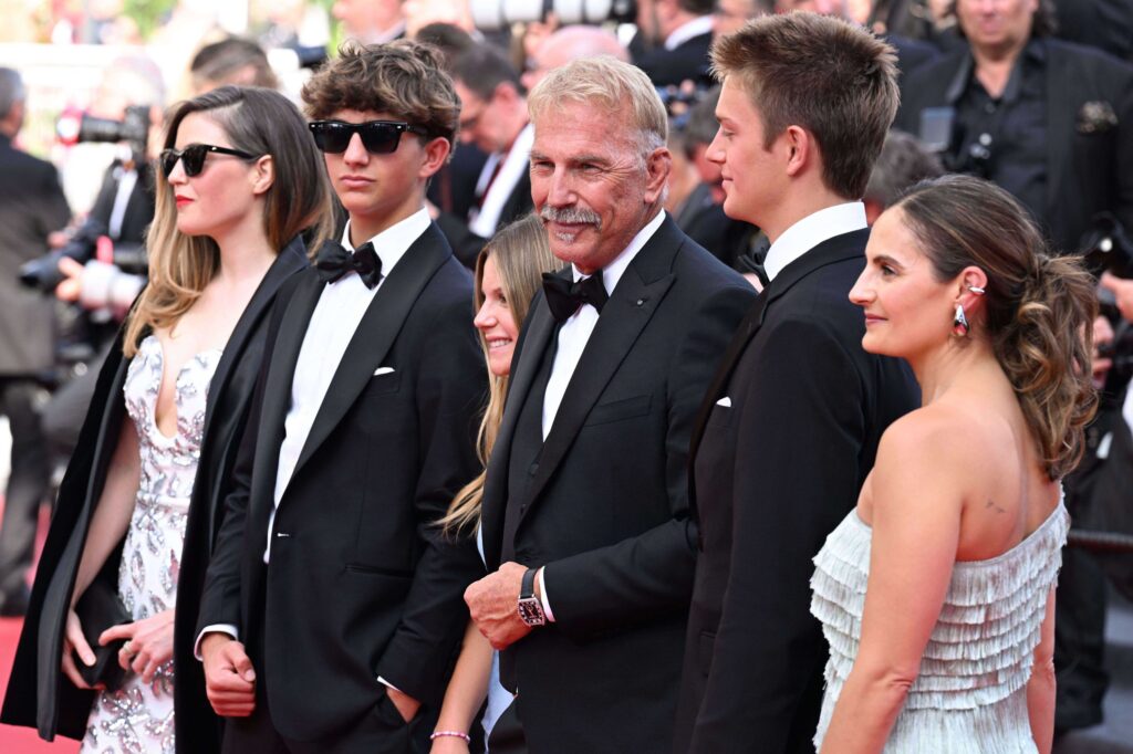 At Cannes, the family red carpet for Kevin Costner and Sienna Miller